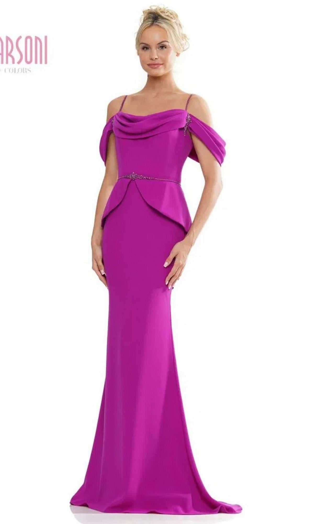 A woman stands against a plain white background wearing the Marsoni MV1271 long formal dress in fuchsia, featuring an off-the-shoulder neckline, stretch crepe fabric, a fitted waist, and peplum detail.